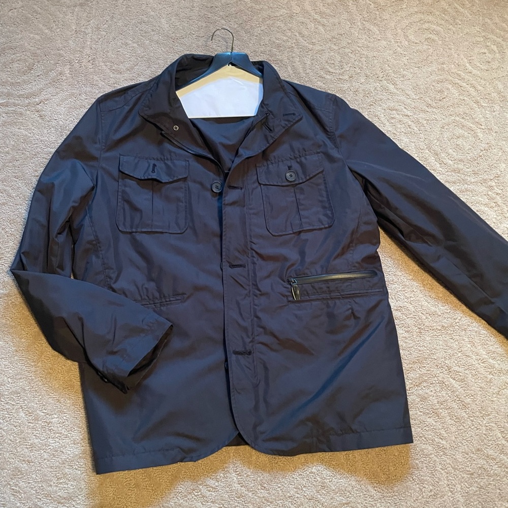 Size L Men’s tumi lightweight jacket. Navy Blue excellent condition
